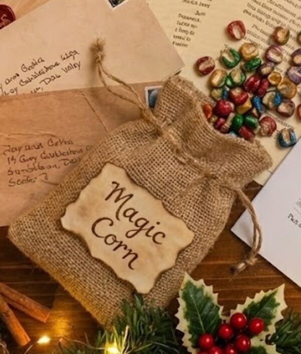 A small burlap bag labelled Magic Corn, with colourful kernels spilling out